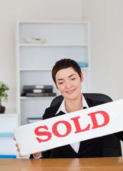Estate agent with a panel — Stock Photo, Image