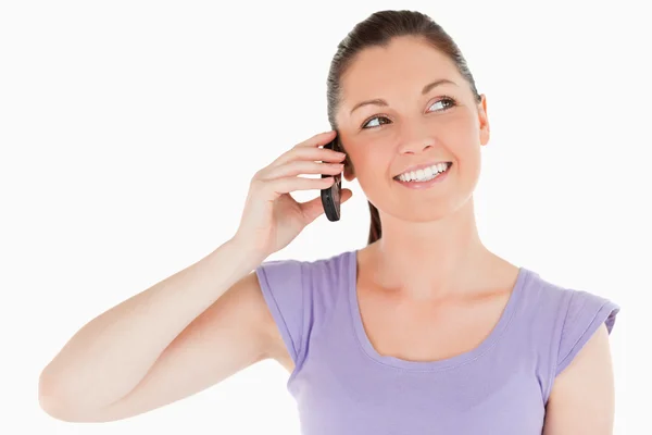 Portrait of a pretty woman on the phone while standing — Stock Photo, Image
