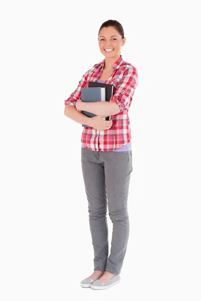 Attractive female posing with books while standing — Stock Photo, Image