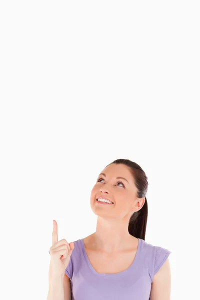 Good looking female pointing at a copy space — Stock Photo, Image