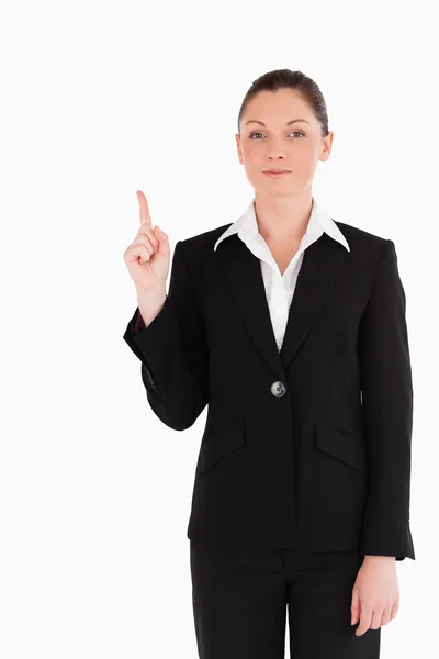 Attraktive Frau im Anzug zeigt auf einen Kopierplatz — Stockfoto