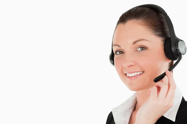 Portrait of a gorgeous woman in suit using headphones and posing — Stock Photo, Image