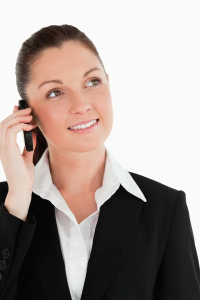 Portrait of an attractive woman in suit on the phone — Stock Photo, Image
