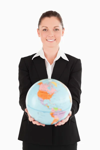 Pretty female in suit holding a globe — Stock Photo, Image