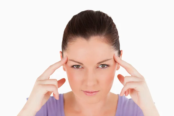 Portrait of a beautiful woman having a headache while standing — Stock Photo, Image