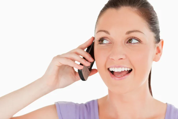 Portrait of a good looking woman on the phone while standing — Stock Photo, Image