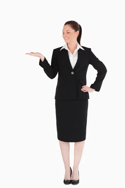 Cute woman in suit showing a copy space Royalty Free Stock Photos