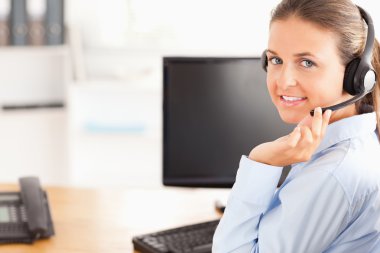 Working woman with a headset clipart