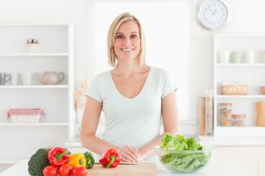 Woman standing in kitchen clipart