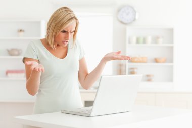 Woman looking at notebook without having any clue what to do clipart