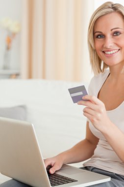 Portrait of cute woman buying online clipart