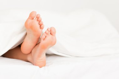 Feet in a bed clipart