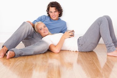 Young couple sitting together clipart