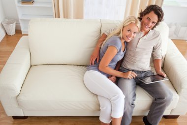 Couple with a tablet computer clipart