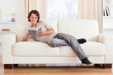 Man holding a book clipart