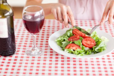 Charming Woman eating lunch and drinking wine clipart