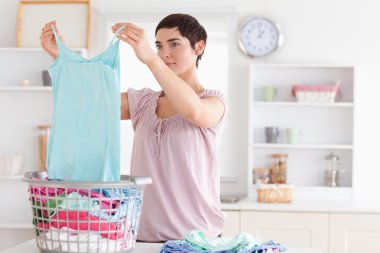 Woman folding clothes clipart