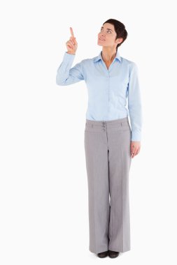 Businesswoman pointing at copy space clipart