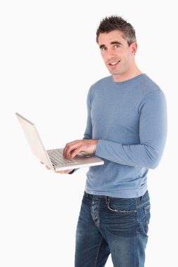 Man using a laptop clipart