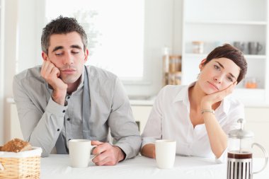 Bored couple drinking coffee clipart