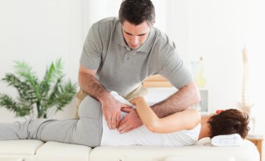 Masseur massaging woman clipart