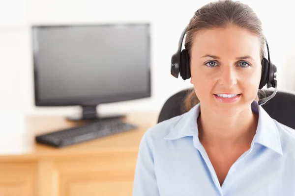 Office worker wearing a headset posing — Stock Photo, Image