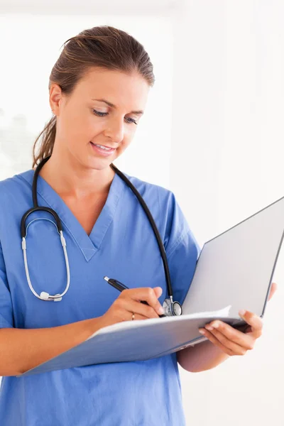 Close up of a doctor with stethoscope and folder — Stock Photo, Image