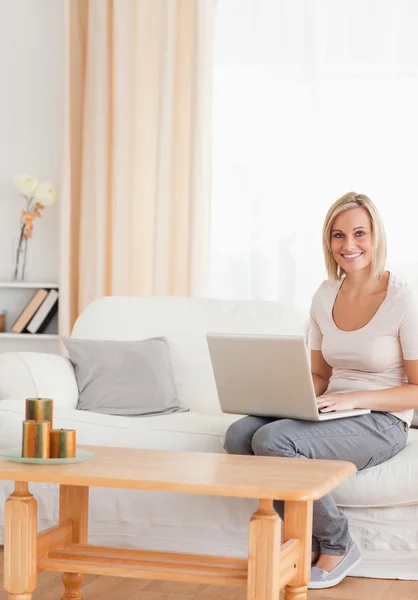 Portrait of a beautiful woman with a laptop — Stock Photo, Image