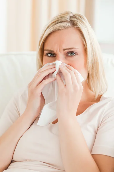 Portrait of a tired woman blowing her nose — Stock Photo, Image
