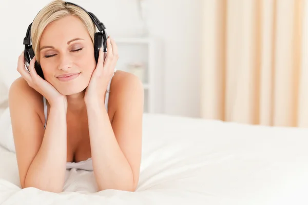 Delighted woman wearing headphones — Stock Photo, Image