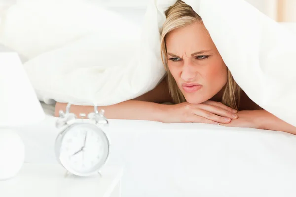 Disgruntled blonde woman waking up — Stock Photo, Image