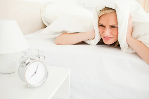 Displeased young woman waking up — Stock Photo, Image