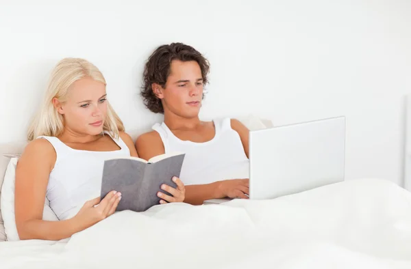 Cute couple in their bed — Stock Photo, Image