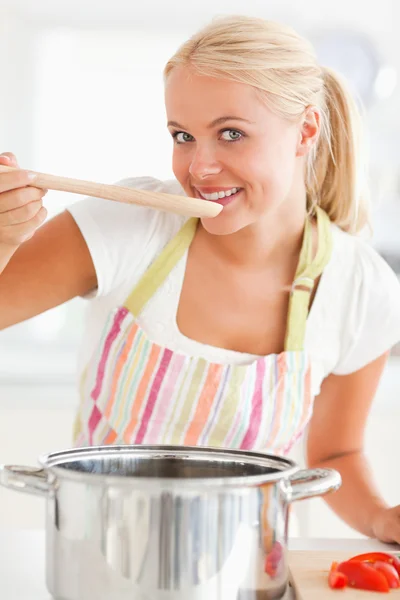 Portrait of a woman tasting her meal — Stock Photo, Image