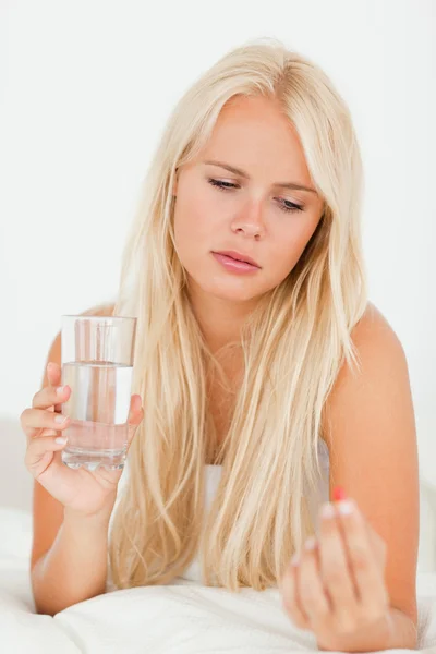 Portrait of a woman taking her medication — Stock Photo, Image