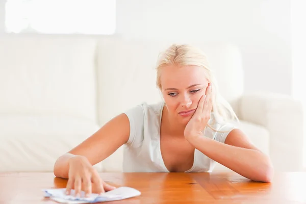 Sad woman with a letter — Stock Photo, Image