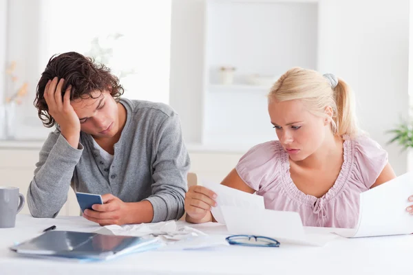 Couple in despair while doing accounts — Stock Photo, Image