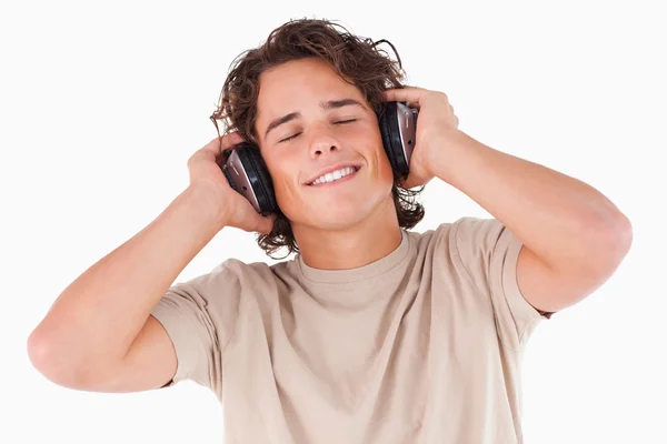 Smiling man with headphones having eyes closed — Stock Photo, Image