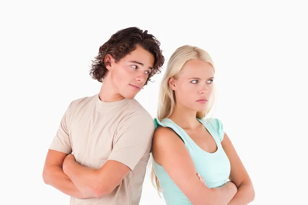 Unhappy couple standing back to back — Stock Photo, Image