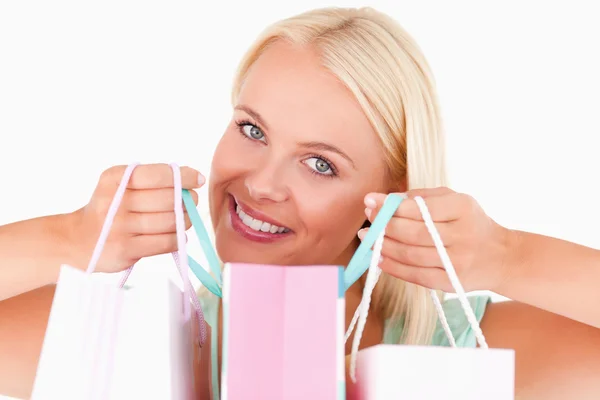 Close up of a woman holding bags — Stock Photo, Image