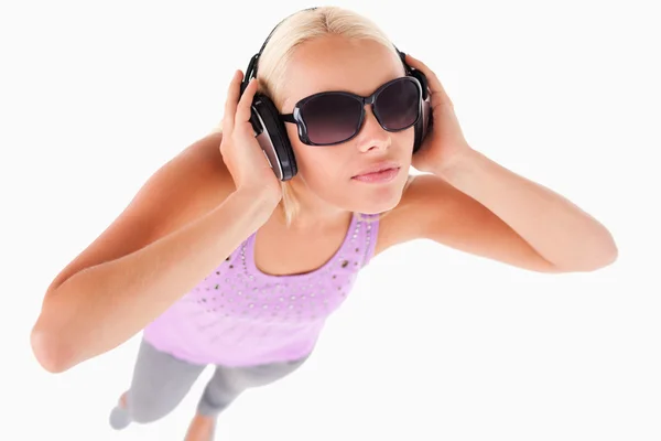 Cheerful woman with sunglasses and earphones — Stock Photo, Image