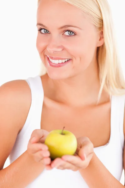 Glorious woman holding an apple — Stock Photo, Image