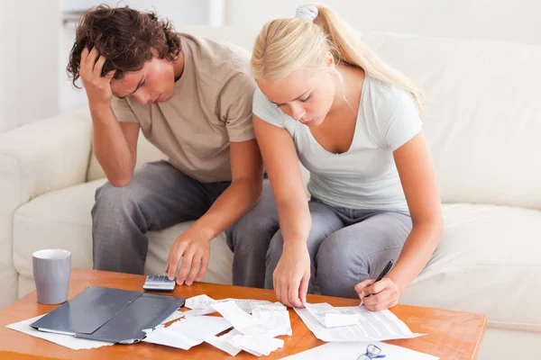 Worn out couple working together — Stock Photo, Image