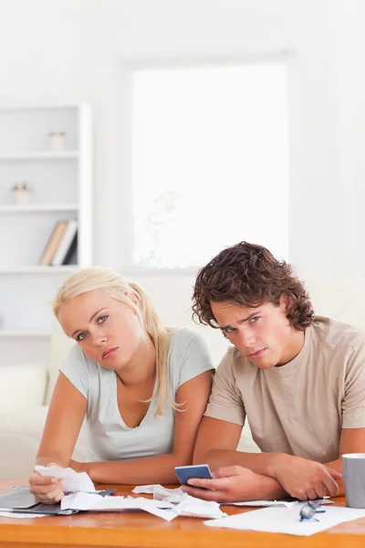 Tired couple looking into the camera — Stock Photo, Image