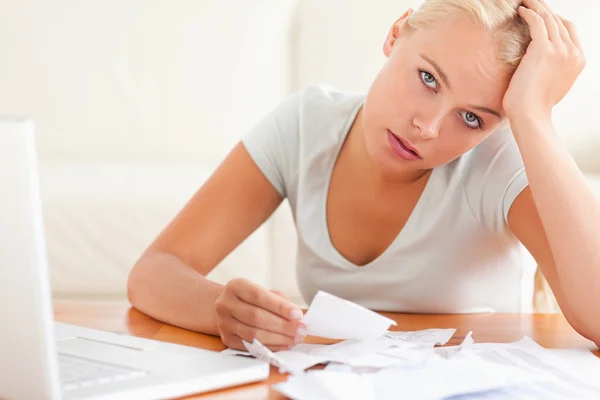 Despaired woman accounting looking into the camera — Stock Photo, Image