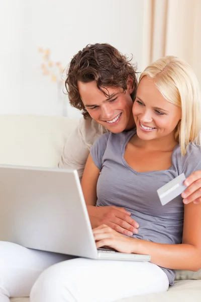 Portrait of a lovely couple shopping online — Stock Photo, Image
