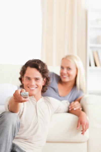 Portrait of a lovely couple watching the television — Stock Photo, Image