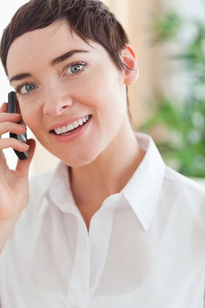Close up of a charming woman with a cellphone — Stock Photo, Image