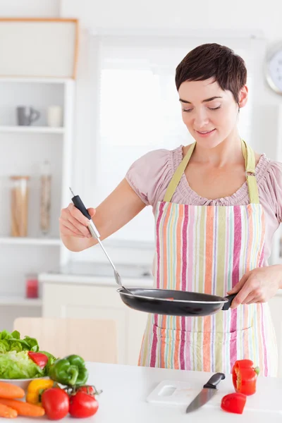 Smiling Woman with a pan — Stock Photo, Image