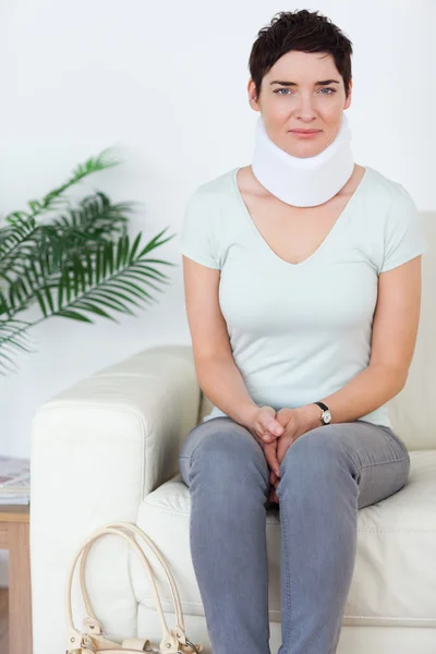 Woman with a surgical collar — Stock Photo, Image
